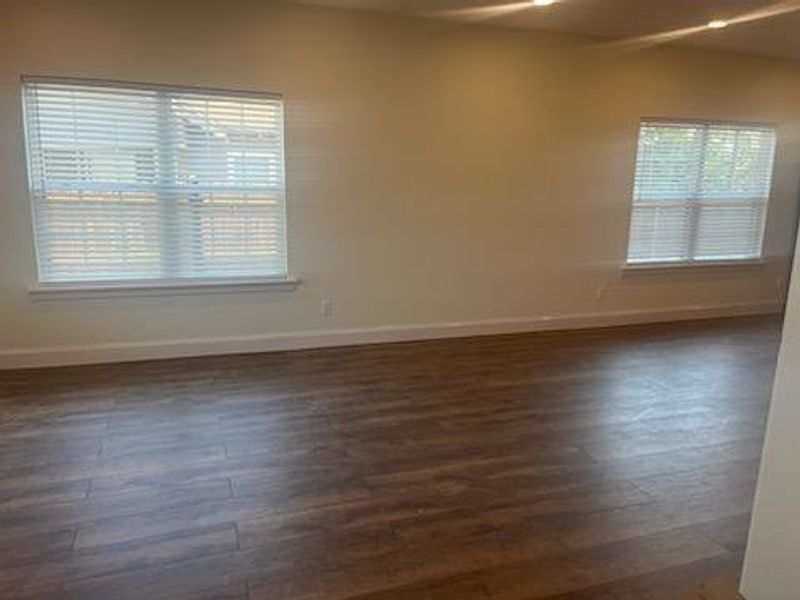 Spare room featuring dark hardwood / wood-style floors