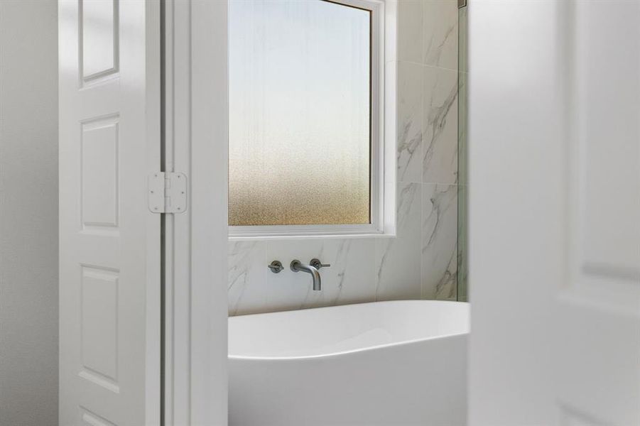 Bathroom with a tub to relax in