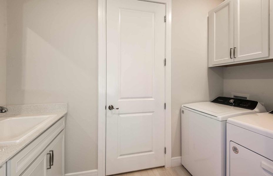 Laundry Room with Built-In Cabinets and Sink