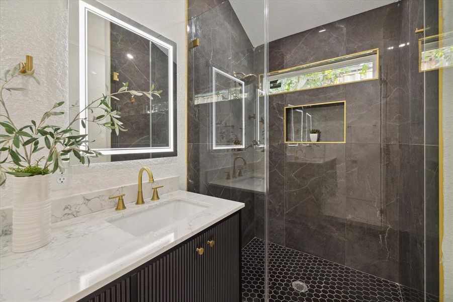 Indulge in the luxurious walk-in shower, featuring exquisite tile work and modern fixtures. Every detail in this fabulous ensuite is meticulously designed to offer a spa-like experience right in the comfort of your home.
