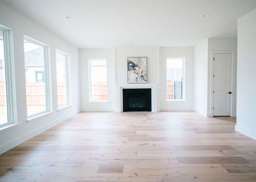 Unfurnished living room with light hardwood / wood-style flooring