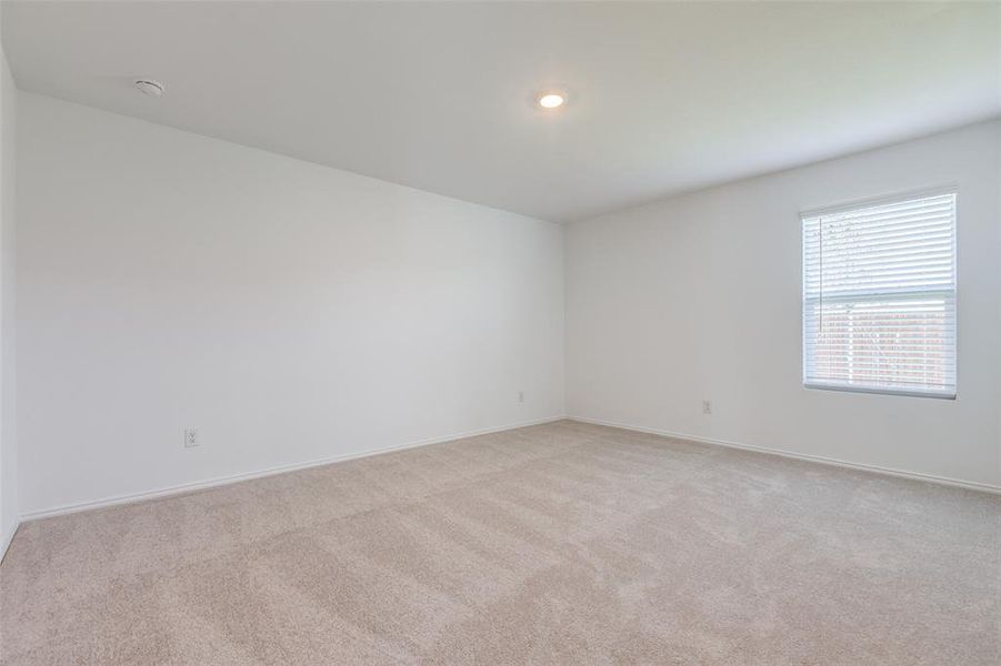 Spare room with light colored carpet