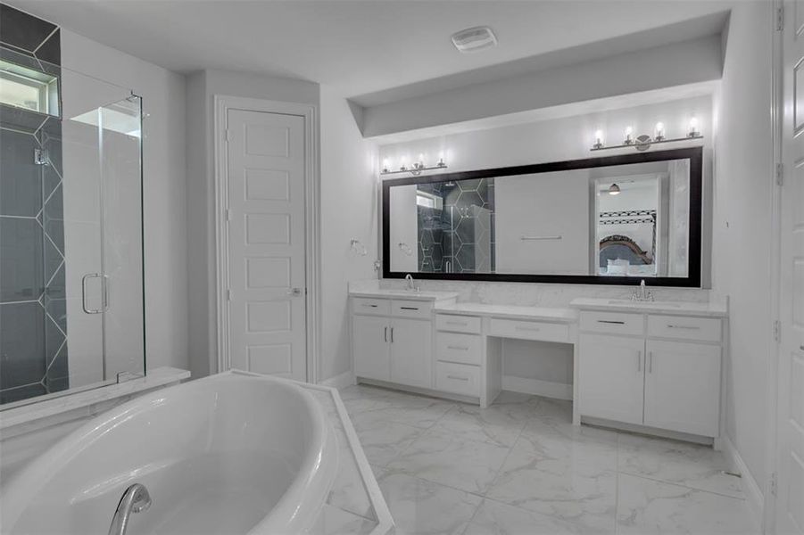 Bathroom with double vanity, tile flooring, and independent shower and bath