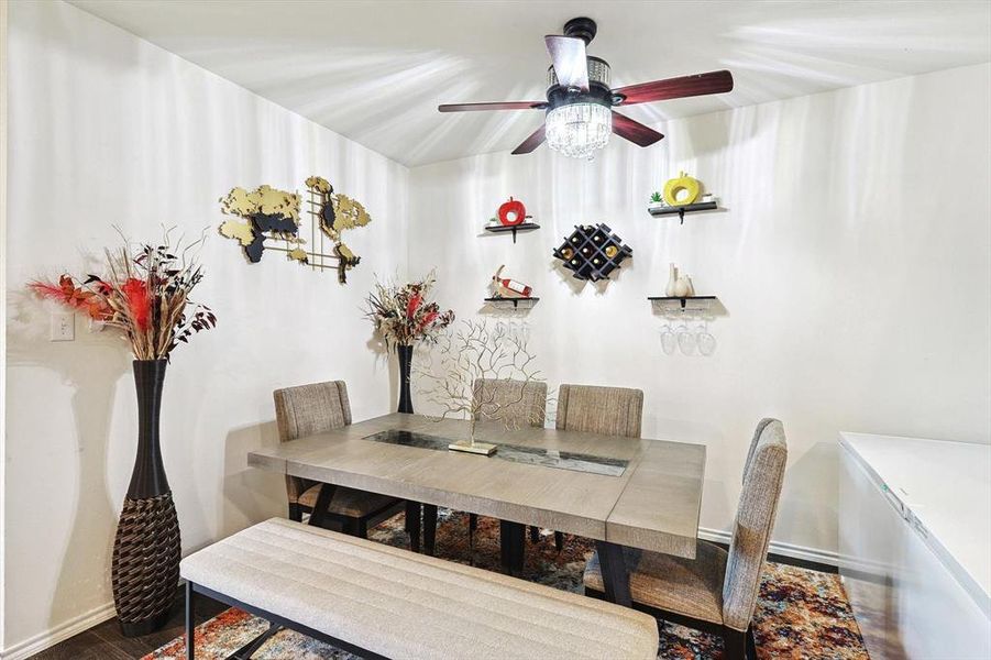 Dining space featuring hardwood / wood-style floors and ceiling fan