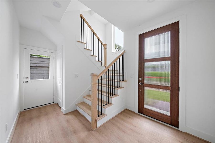 The foyer is open and bright with access to back yard space, secondary bedroom, study and garage.