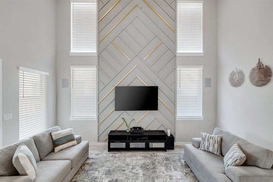 Living room featuring a high ceiling