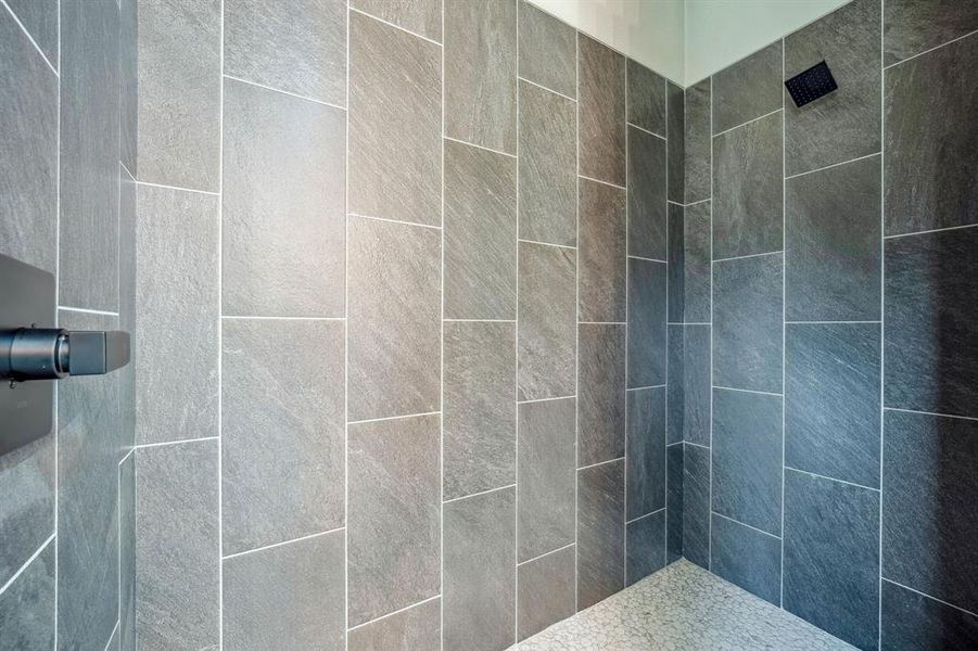 Bathroom featuring tiled shower