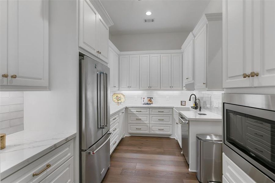 Wow is what you will say about this Prep Kitchen. Another dishwasher, farmhouse sink and much more storage for your kitchen appliances etc. To the right is the walk in pantry that is quite amazing as well. This is a chef's dream!!