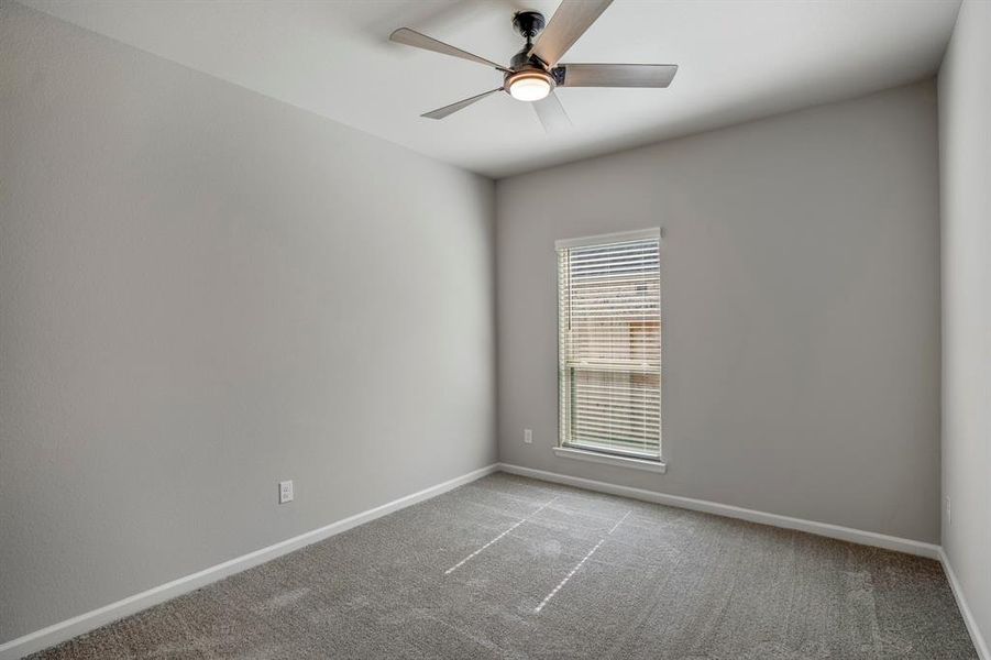 One of three secondary bedrooms