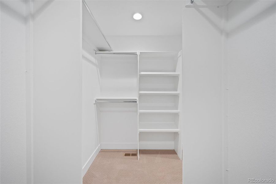 Extra storage has been added to walk-in closet with separate access to the laundry room.