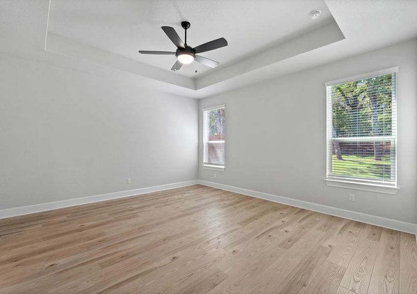 The master bedroom has soaring ceilings.