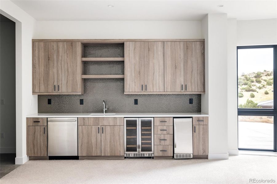 Family room wet bar with dishwasher, beverage cooler and ice maker