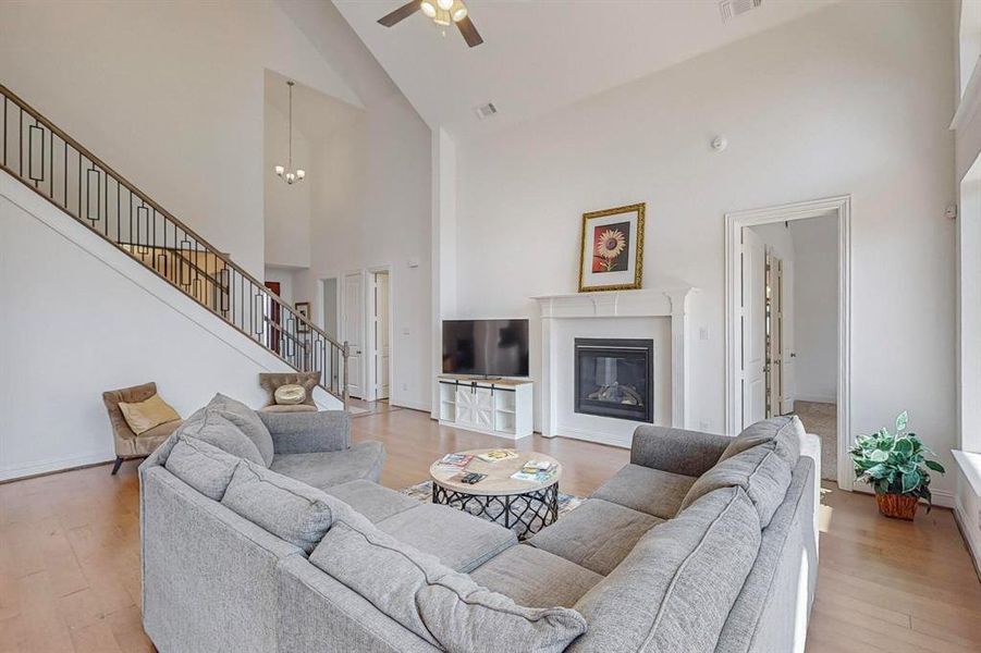 Another view of the Large Open Living Room showcasing the fireplace and space to mount your QLED TV!