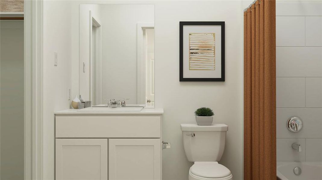 Full bathroom featuring vanity, toilet, and shower / tub combo with curtain