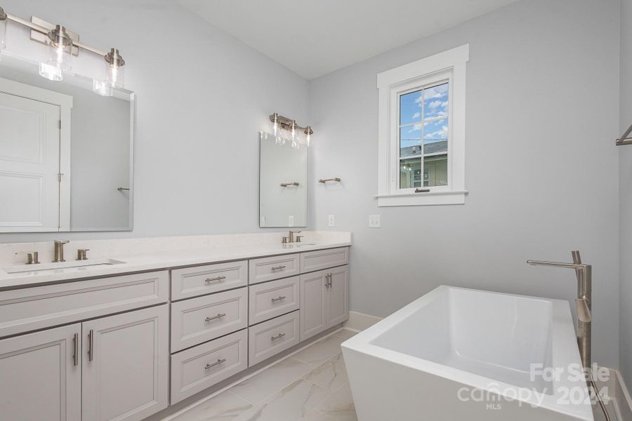 Primary bath elegant vanity & tub