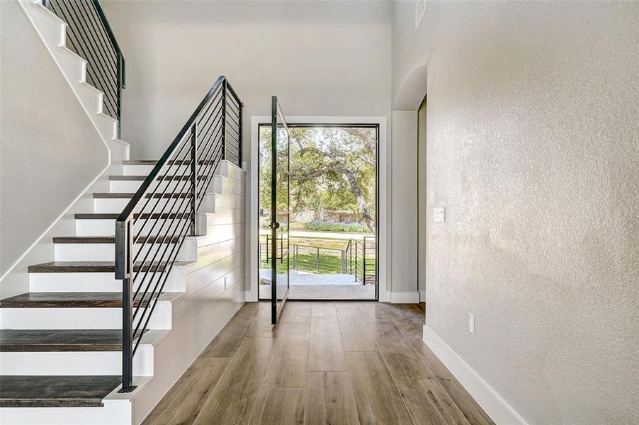 iron railing and wood treads leading you to your upstairs living.