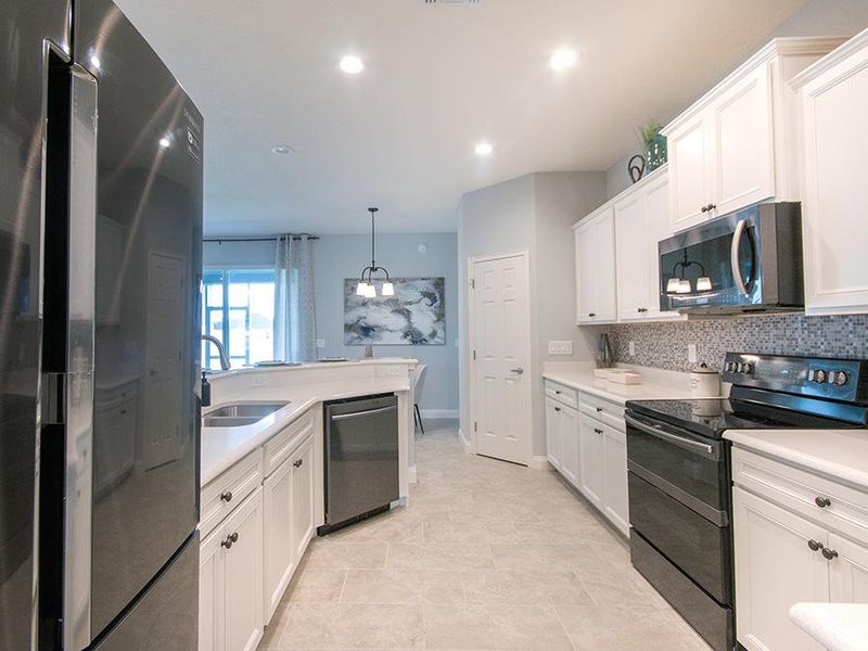 Kitchen with walk-in pantry - Westin home plan by Highland Homes