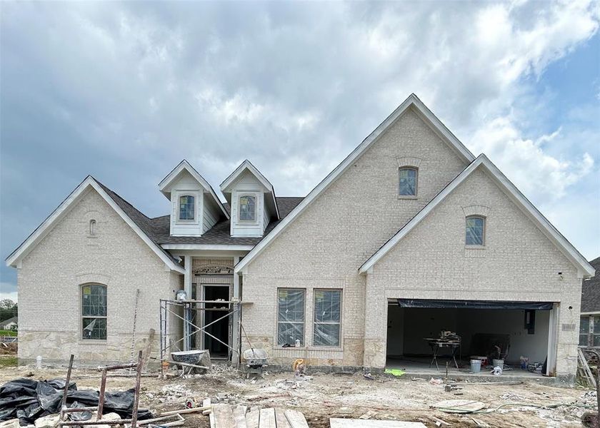 One-story home with 4 beds, 3 baths and 2 car attached garage on a lake lot