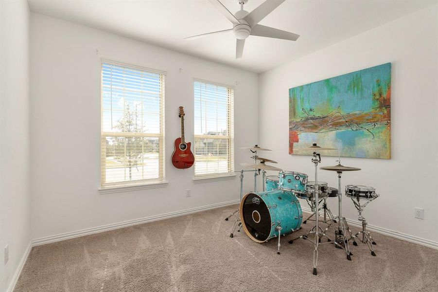 Miscellaneous room featuring carpet floors and ceiling fan