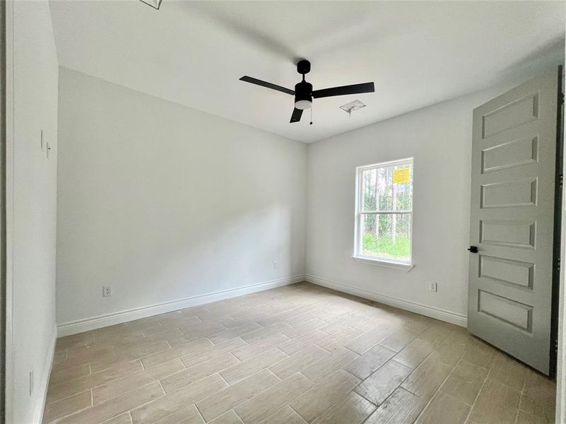 LARGE BACK COVERED PATIO WITH HIGH CEILINGS & CEILING FAN.