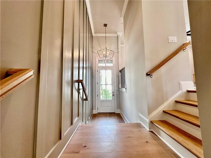 Gray wall trim is outfitted on foyer wall, bringing the space to life