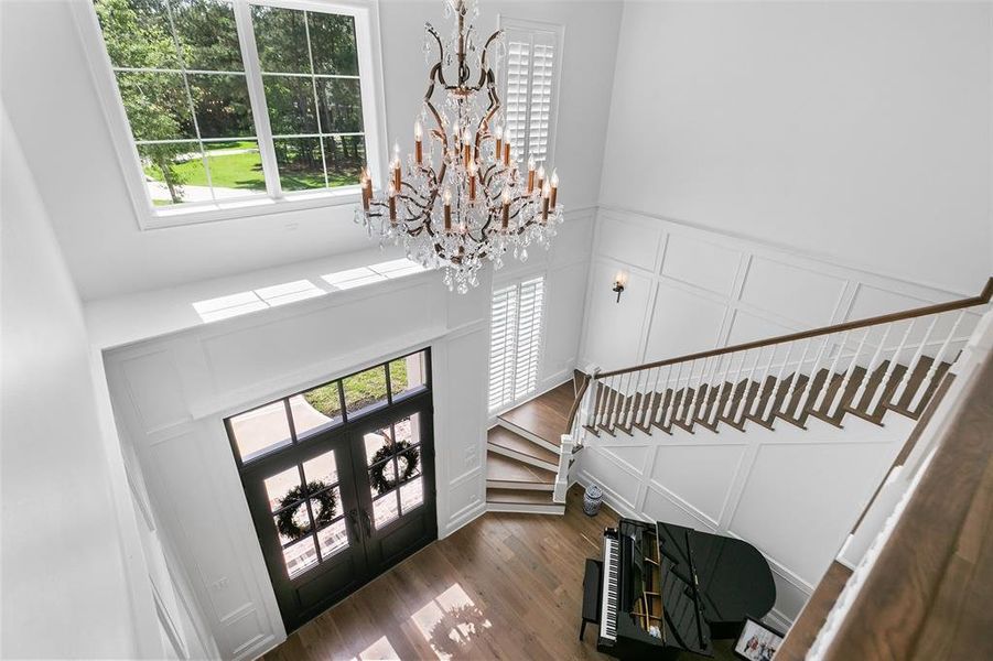 A view from the second story of the absolutely gorgeous and unique light fixture in the foyer.