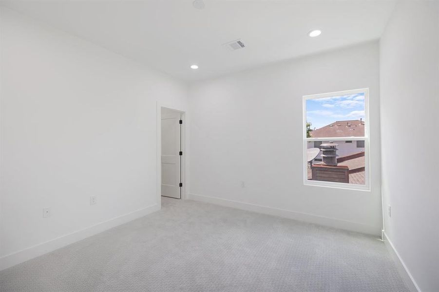 Third floor secondary bedroom.