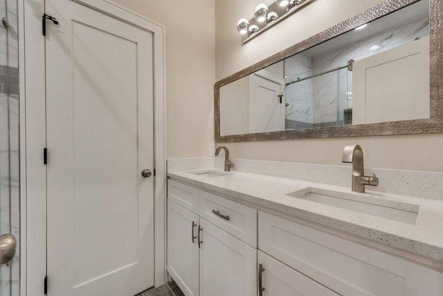 Bathroom featuring dual vanity