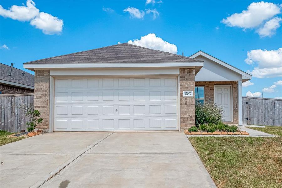 This home boasts ample parking for you and your guests, featuring a long double-wide driveway and a spacious two-car garage.