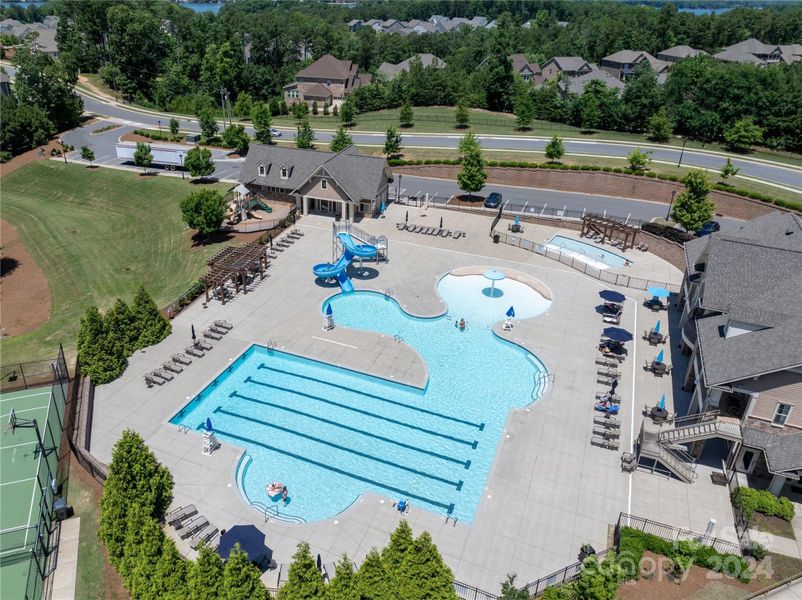 Pool has splash area and slide