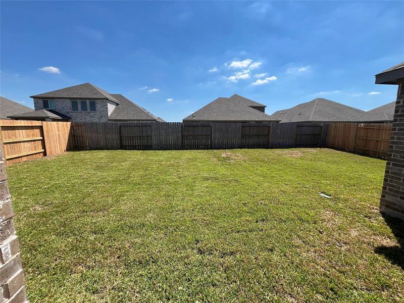 The spacious backyard is fully sodded and has built in sprinkler system.