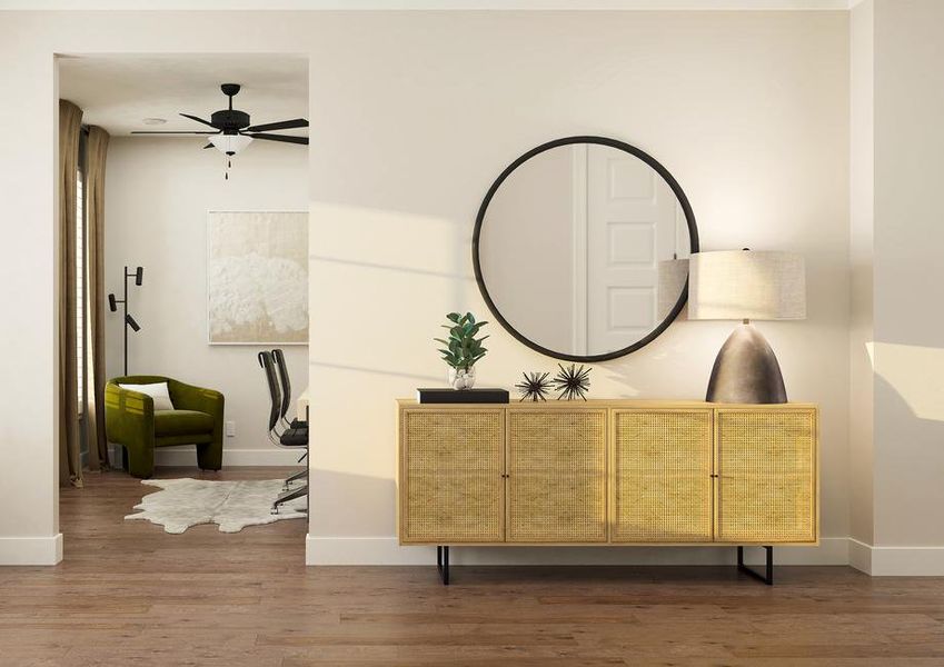 Renderings of foyer that is furnished
  with wall dÃ©cor and a table.