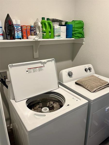 Laundry area with washer and clothes dryer