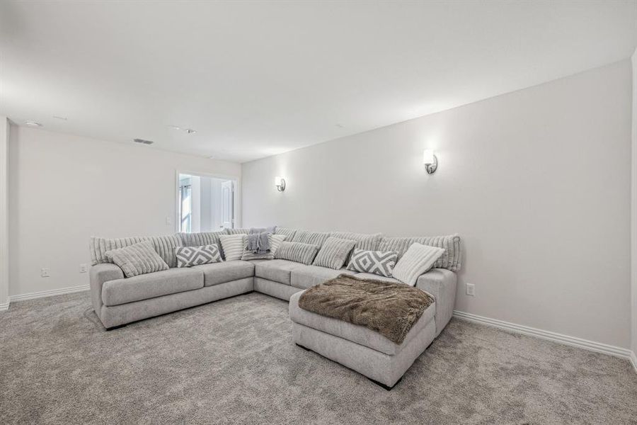 Living room featuring light colored carpet