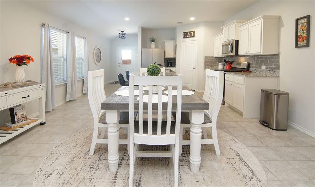 Dining area featuring light tile patterned floors