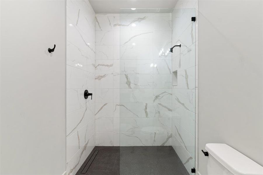 Designer tile from floor to ceiling in this walk-in closet.