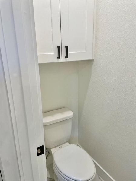 Separate commode room at primary bathroom