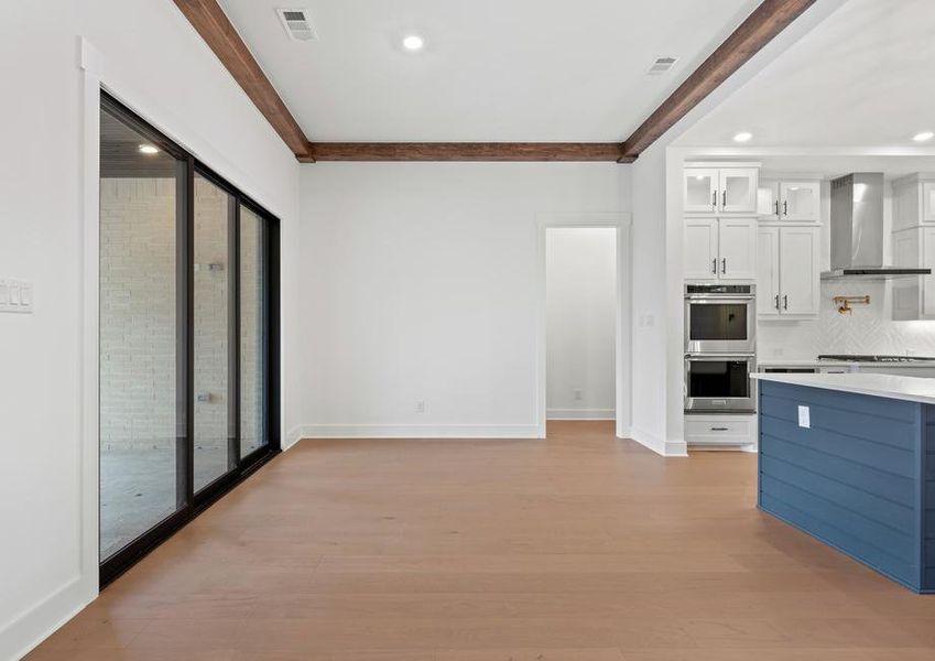 The open breakfast area has plenty of natural light from the sliding back doors.