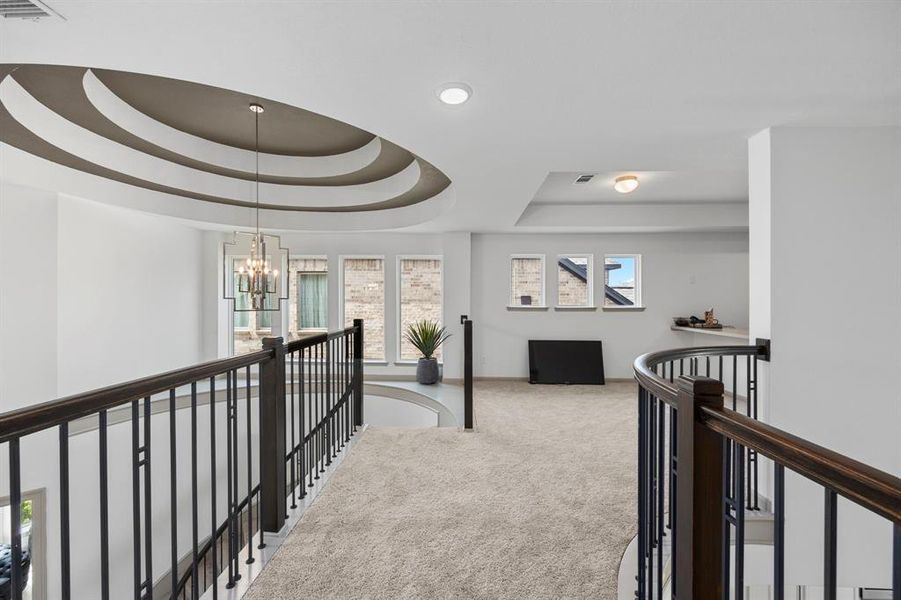 This gorgeous home includes this catwalk to connect the game/media room and the secondary bedrooms.