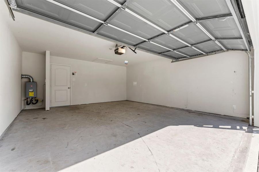 Very large garage with tankless hot water heater.