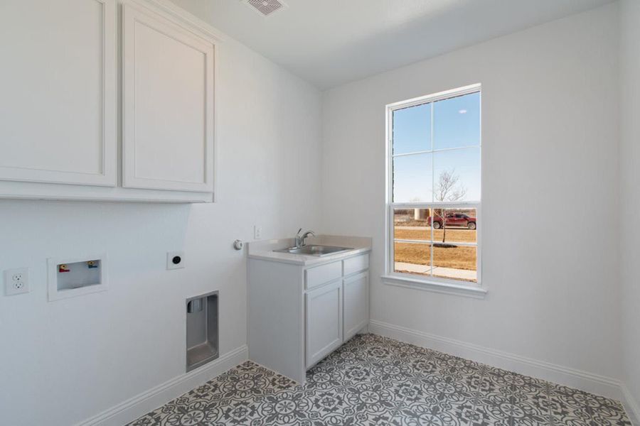 Laundry Room | Concept 2406 at Hidden Creek Estates in Van Alstyne, TX by Landsea Homes