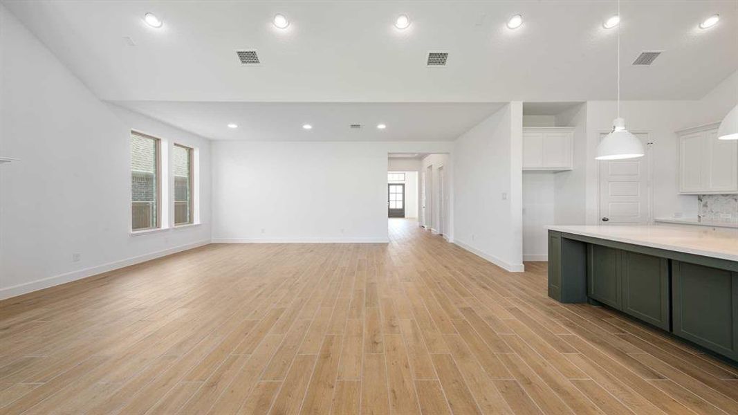 Unfurnished living room with light hardwood / wood-style flooring