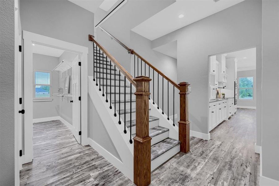 Staircase with hardwood / wood-style floors