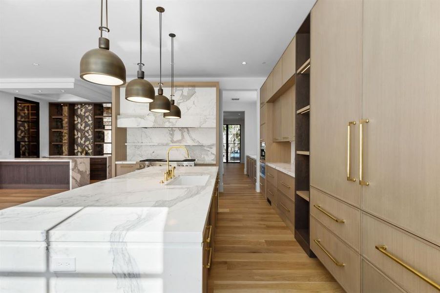 Kitchen with Wood Mode cabinetry and Calcutta Marble