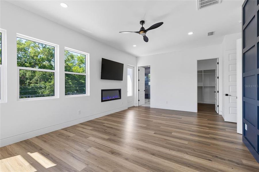 Primary Ensuite with Fireplace, TV and views of downtown Tampa