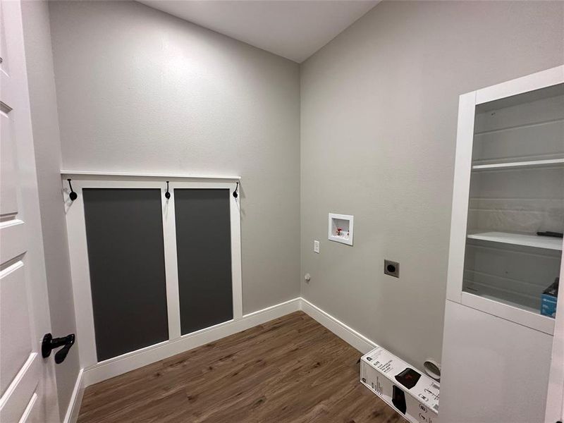 Laundry area featuring electric hook up for full size washer and dryer. With built-in linen closet and MUDROOM space.