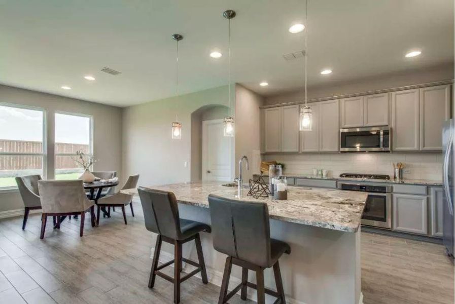 Photo of Pulte model home with same floor plan, not of actual home listed.