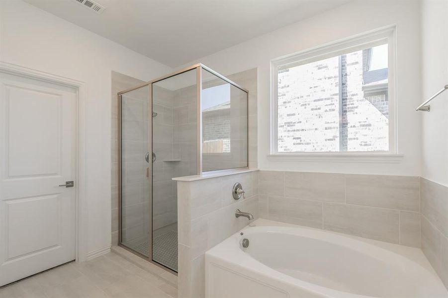 Bathroom featuring plus walk in shower