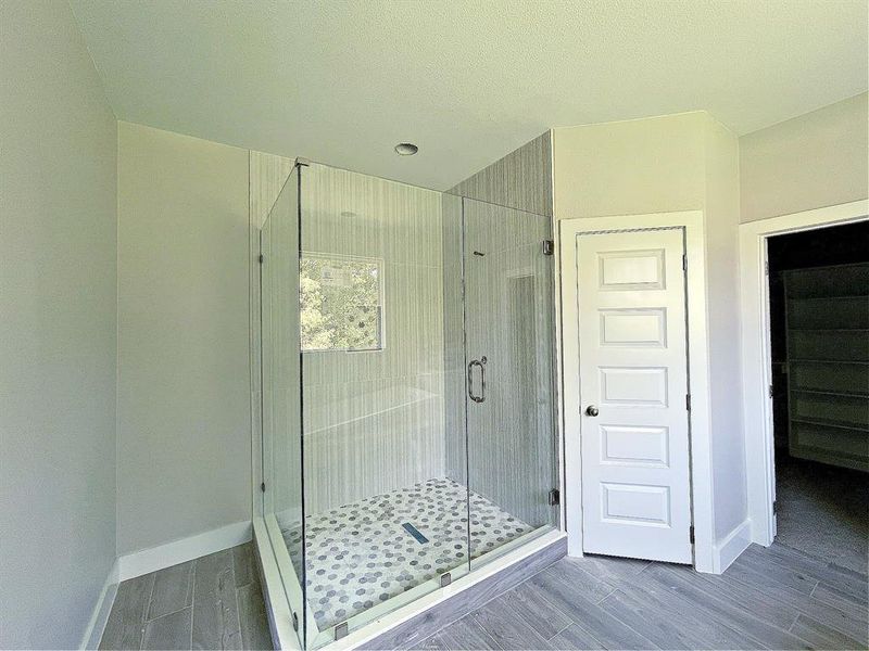 Beautiful custom shower with separate toilet area, HUGE walking-in closet and his and her vanities