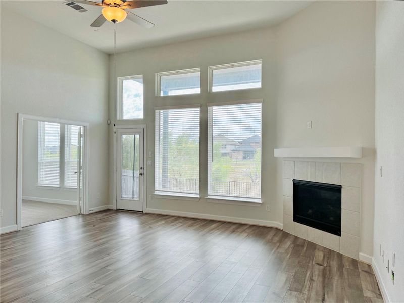 Living room with fireplace, and entrance to the office